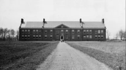 A early view of Mason Hall alone in the field off Central Ave. 